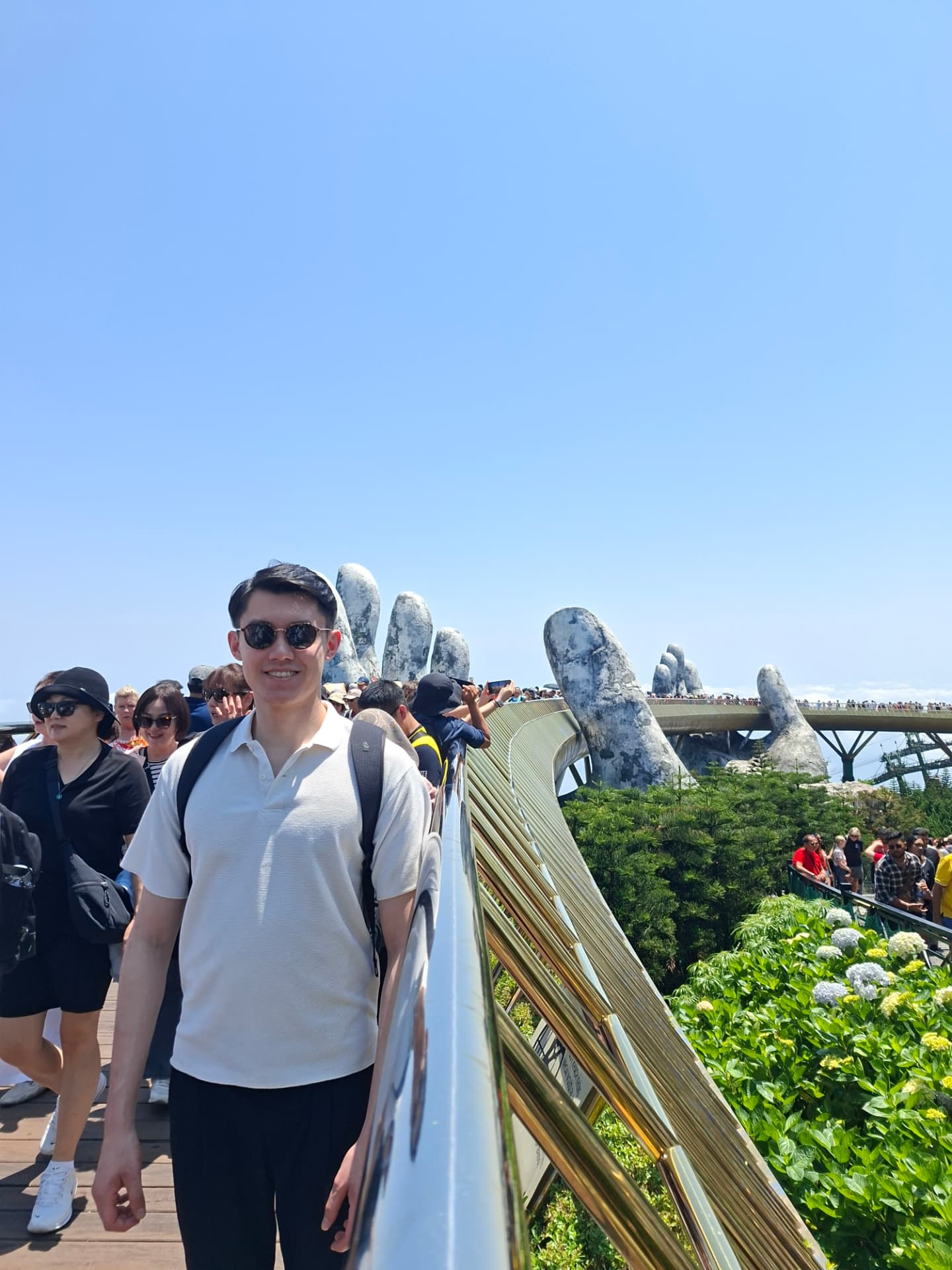 Donald Tsang outdoors at the Golden Bridge in Da Nang